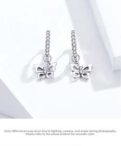 Detail of S925 sterling silver butterfly earrings with pavé set zircon stones