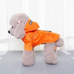 Detail of orange pet raincoat with honeycomb texture, hood, and reflective striping