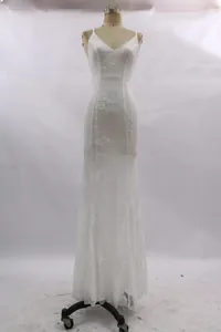 Detail of white lace embroidery and V-neckline on a floor-length mermaid evening dress