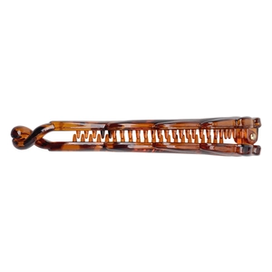 Banana hair clip with brown tortoise shell pattern made of durable resin on white background