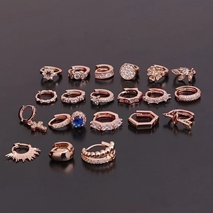 Set of 16 rose gold cartilage earrings featuring zircon flowers, stars and geometric designs