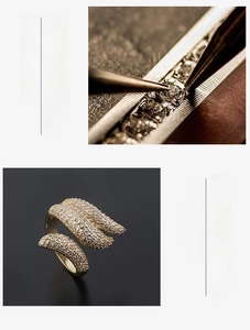 Close-up of golden feather wing ring featuring micro-pave cubic zirconia setting