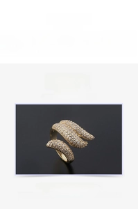 Macro detail of leaf design open ring with gold plating and cubic zirconia pave
