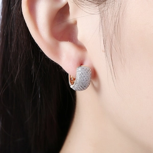 Silver row-set zircon U-shaped ear cuffs shown on model for a minimalist jewelry look