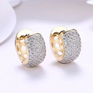 Elegant gold hoop earrings featuring a single row of sparkling white cubic zirconia stones