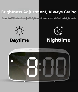 LED mirror alarm clock showing dual brightness modes for day and night display settings