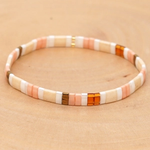 Bohemian stackable Tila bead stretch bracelet with colorful enamel tiles on wood