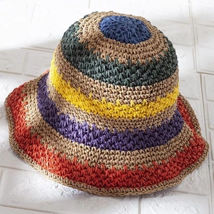 Colorful handmade crochet sun hat with vibrant striped patterns for summer vacation