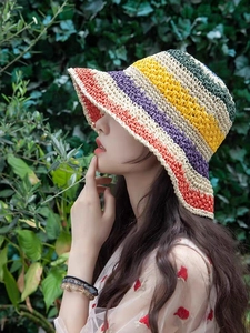 Close-up of colorful striped crochet sun hat texture with vibrant woven patterns