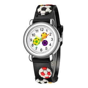 Detailed view of children's soccer watch with 3D embossed football silicone strap