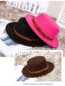 Detailed view of flat top wool fedora hats in fuchsia black and brown with leather bands