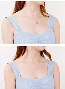 Detail of Korean style titanium steel necklace featuring pink crystal glass pendants