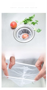 Close-up of flexible white mesh strainer bag trapping food debris in kitchen sink