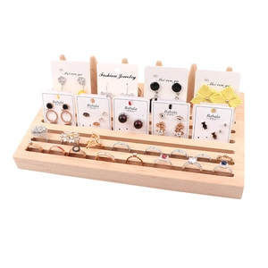 Multi-tier beech wood jewelry display stand for rings and earrings on white background