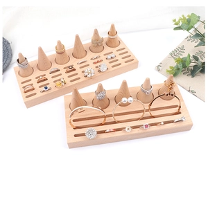 Top view of natural beechwood cone ring stand and jewelry display slots for rings