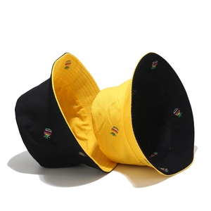 Double-sided sun hat with pineapple embroidery in yellow and black reversible colors
