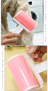 Washable pink lint roller detail showing protective film removal on a beige sweater