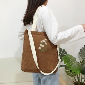 Brown corduroy daisy embroidered tote bag with white wide strap for casual daily use