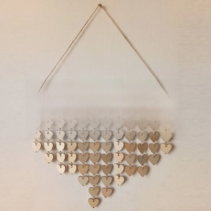 Detail of wooden calendar board Days to Remember with heart tags and metal rings