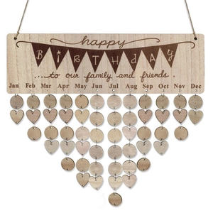 Detail of wooden birthday tracker with heart and round tags for home party wall decor