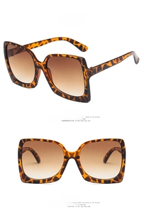 Front and side view of oversized square leopard print sunglasses with brown gradient lenses