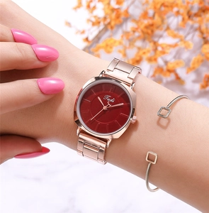 Elegant rose gold women's quartz watch with burgundy dial and matching metal bracelet