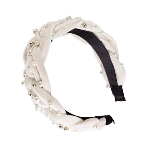 Detailed view of beige velvet twisted headband with faux pearls and silver beads detail