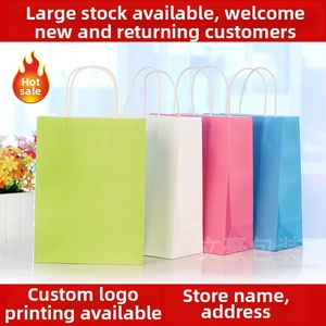 Macro shot of assorted colorful cardboard gift bags with white braided rope handles