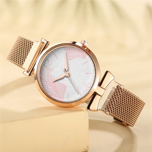 Elegant rose gold women's quartz watch with leaf pattern dial and magnetic mesh strap