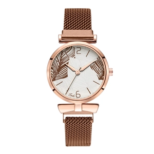 Detail of rose gold mesh strap and elegant leaf pattern dial on a quartz watch