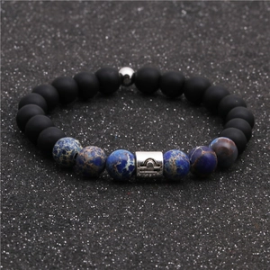 Detail of Libra zodiac bead bracelet with black matte beads and imperial stone texture