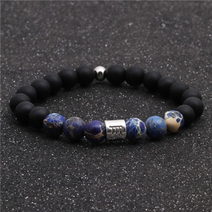 Detail of Virgo zodiac beaded bracelet with matte black beads and blue imperial stone