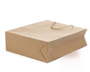 Detail of square bottom and foldable side of kraft paper gift bag with woven rope handle