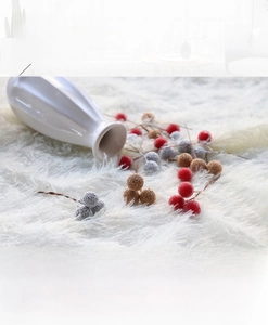 Detailed view of handmade glass microbead berries with frosted texture for DIY floral crafts