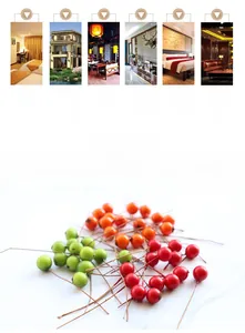 Macro shot of artificial red, orange, and green berries with wire stems for home decoration