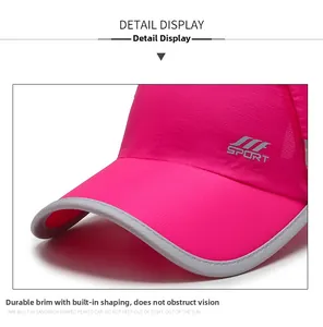 Macro detail of breathable rose red quick-dry sports cap with grey SPORT logo print