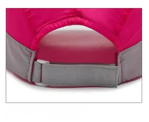 Close-up of quick-dry rose pink baseball cap showing mesh texture and gray buckle