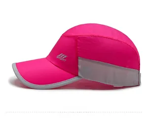 Detail of rose red sport cap featuring breathable grey mesh panels and side logo