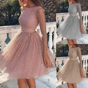Close-up of sparkling sequin mesh fabric on evening dresses in pink and silver
