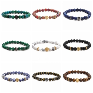 Detail showcasing nine variations of lion head beaded bracelets with natural stones and textures