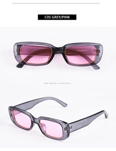 Detailed view of retro rectangular sunglasses in grey translucent frame with pink lenses