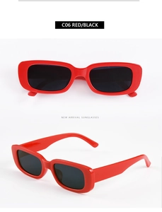 Close-up of retro rectangular red frame sunglasses with dark lenses from model C06