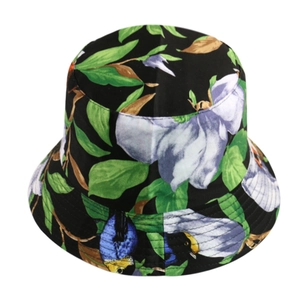 Close-up of black fisherman hat with tropical floral print on a white background