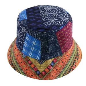 Detailed close-up of colorful patchwork bucket hat with vintage ethnic floral prints