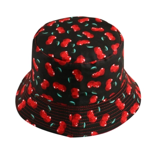 Detailed view of black bucket hat featuring cherry print and reinforced brim stitching
