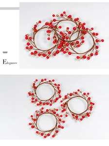 Detail of red and gold berry wreath rings for Christmas table decor with woven branch base