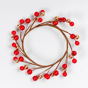 Artificial red berry and gold ball Christmas candle ring wreath on white background
