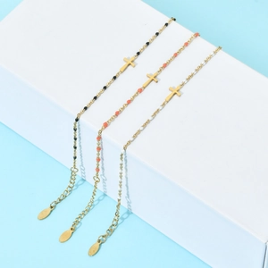 Minimalist stainless steel cross bracelets with colorful beads in black, red, and white