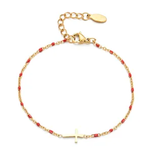 Gold stainless steel cross bracelet with red enamel beads and adjustable chain closure