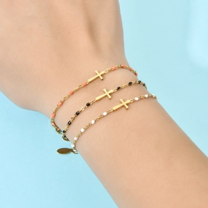 Three-piece gold cross bracelet set with colorful micro beads on minimalist chain